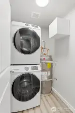 This utility room with included washer/dryer is located in the unit.