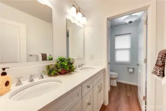 Updated guest bathroom with double sinks.