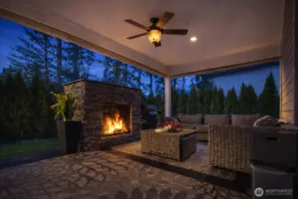 Outdoor Living Space at Twilight:  With the click of a button roll the shades down for a more intimate setting a talk the night away or snuggle in front of the fire