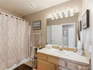 Full bathroom with dual access (continental style) for guests and primary suite