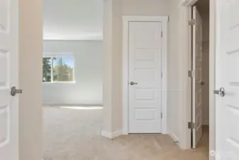 Double door entry to owner's suite includes large walk-in closet, linen closet, coffered ceiling, large windows.  *Photos not of actual home - same floor plan in a different community*