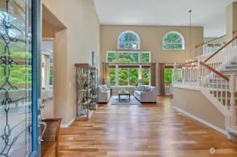 Enter on to newly refinished hardwood floors and you'll be captivated by the wall of windows that frame the greenbelt views.