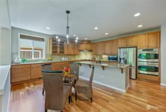 Double ovens, french door fridge, gas cooktop . . . it's all here, plus an informal eating space.