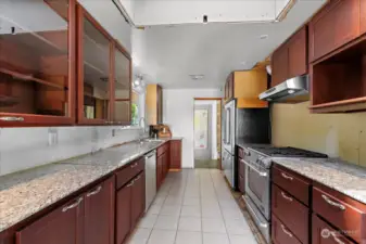 Kitchen, where owner did not complete renovations, with stainless steel appliances.