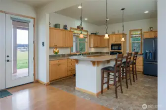 Living area, kitchen, entryway in the back right corner