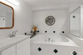 Primary bath with jetted tub and shower.