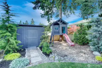 Custom Treehouse built with Love--adds a touch of whimsy. Extra storage for outdoor supplies.