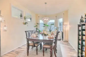 Formal dining room with bay windows.