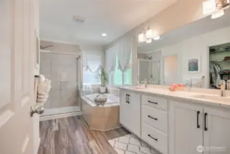 Updated Primary bath with quartz countertop with white cabinets