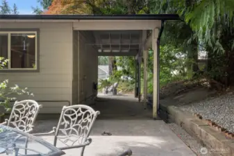 This covered patio area is great for storing yard tools or maybe install a tv and put a sectional out there and enjoy some golf or football on tv!