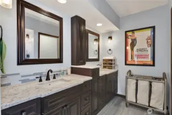 Primary bathroom with dual vanities.