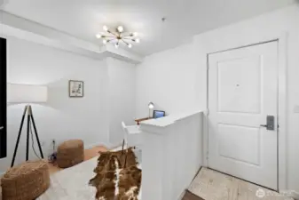 Office right as you enter. Could easily hold a Murphy bed and double as a guest room.