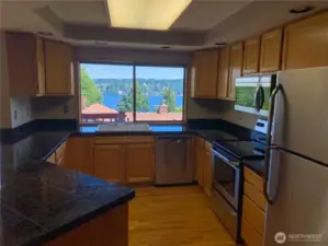 Kitchen with plenty of cabinetry and views