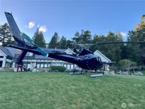 Helicopter can land in the front yard in multiple locations. There is also a private airport 5 minutes away in Roche Harbor. This is a real photo, not AI.