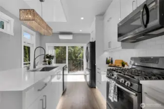 Kitchen-Quartz counter top. Gas stove