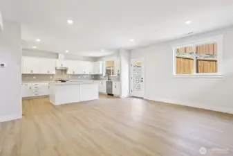 View from family into kitchen with access to fully landscaped rear yard.