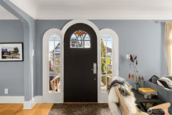 Architectural integrity shines through original glass and signature arched transitions