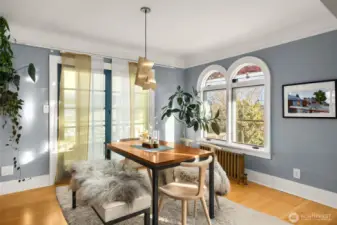 Bright windows pour in natural light making an especially peaceful dining space