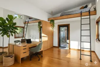 A home office with sleeping/lounging loft. This image is virtually staged.