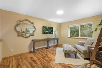 A versatile and expansive bonus room serves as the perfect media lounge, playroom, home office or home gym. With large windows flooding the space with natural light and a flexible layout, this room adapts to any lifestyle need.
