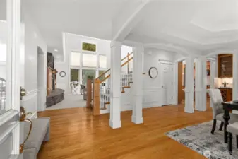Formal dining room framed by architectural columns and elevated millwork