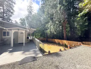 This secluded quarter-acre property is bordered by a greenbelt in a park, offering a tranquil and nature-rich environment.