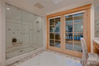 Shower and double doors leading to outside deck area.