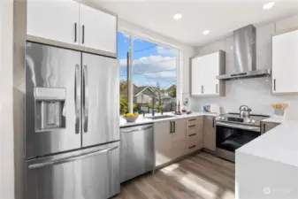 A bright, airy kitchen with a spacious layout, stainless steel appliances, and elegant finishes.