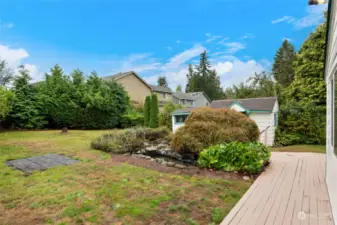 The fenced area ensures a safe, enclosed environment for pets and children to play, while also providing a peaceful retreat to unwind.