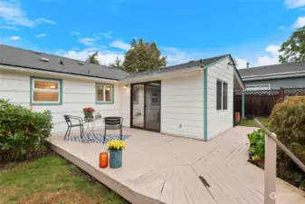 The deck off the family room provides a perfect outdoor extension of the home, ideal for relaxing or entertaining.