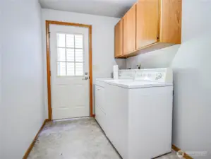 laundry with door to court yard