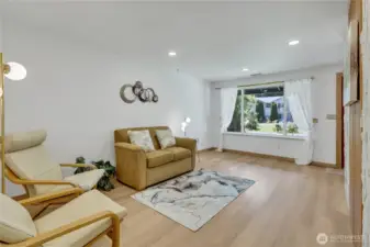 Great sized living room with blonde finished hardwood floors...