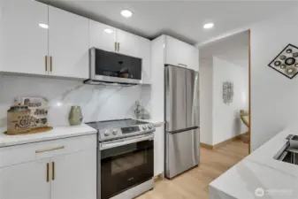 The cabinets are custom designed high gloss finishes and brass colored handles for an elegant style...