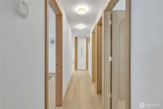 Kenmore luxury vinyl plank flooring leads to the bedrooms and bath.