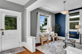 Gorgeous fir floors, high ceilings, windows galore, and beautiful period details can be found throughout the entry, living, and dining.