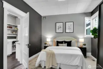 Large primary bedroom with an entrance to the bathroom.