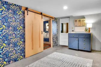 Basement storage/shop area. Entrance to the office.