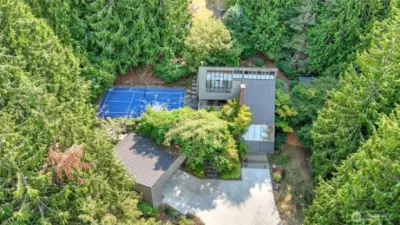 Aerial view showcase this exceptional property with a private pickleball court.