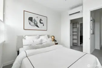 Primary bedroom with walk-in closet and ensuite bathroom