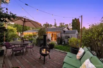 Spacious back patio designed for outdoor dining, entertaining, and relaxation