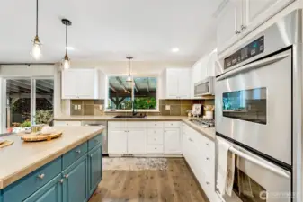 Warm vibe to this chef inspired kitchen