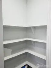 Close up View of the Walk In Pantry with 4 Shelves for a lot of Staorage.