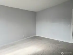 Another View of the Primary Master Bedroom Showing Cathedral Ceilings, All New Paint, Trim and Carpeting.