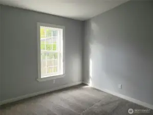 Another Picture of the Spacious Fourth Bedroom with New Paint, Trim and Carpeting.