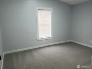 Picture of the Spacious Third Bedroom with New Paint, Trim and Carpeting.