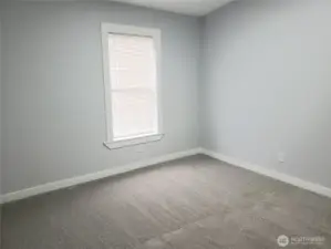 Another Picture of the Spacious Fourth Bedroom with New Paint, Trim and Carpeting.
