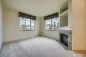 Walls of windows throughout the home bring in abundant natural light and a warm, airy feel.