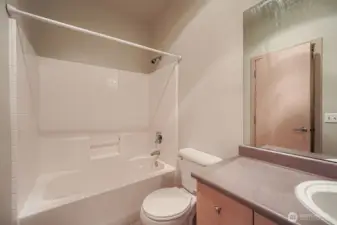 Sparkling full bath with modern fixtures and a clean, timeless design.