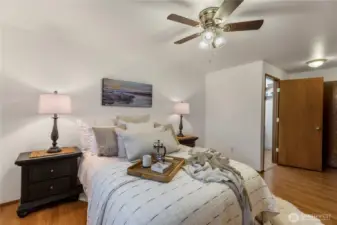 Primary bedroom with 1/2 bath attached and two closets