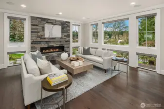 You’ll be surrounded by light in this living room.  All windows have custom electric blinds, so be prepared to enjoy views of Lake Washington from your favorite sofa.